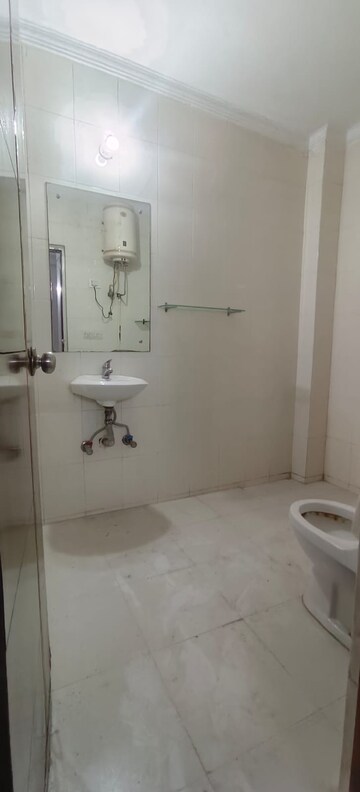 Bathroom in 3 BHK Builder Floor at Freedom Fighters Enclave – for Rent