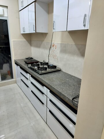 Kitchen in 2 BHK Apartment at Piramal Vaikunth, Balkum Pada – for Rent