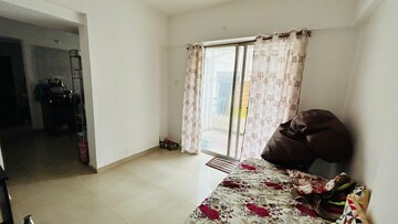 Living Room in 1 BHK Apartment at Alpine Aura, Moshi – for Rent