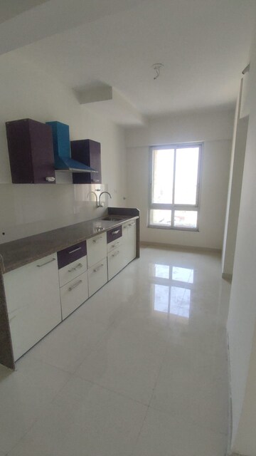 Kitchen in 1.5 BHK Apartment at Puranik Rumah Bali, Ghodbunder Road – for Sale