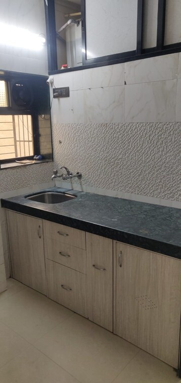 Kitchen in 2 BHK Apartment at Anu vitthal CHS, Dombivli West – for Sale