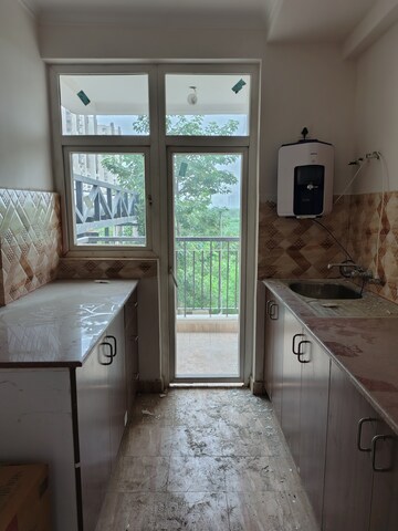 Kitchen in 2.5 BHK Apartment at Amrapali Riverview, Amrapali Leisure Valley – for Rent