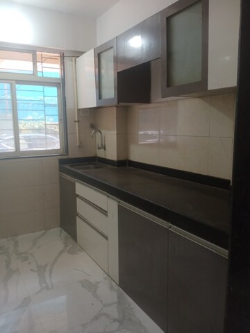 Kitchen in 2 BHK Apartment at RNA N G Silver Spring, Mira Road – for Rent