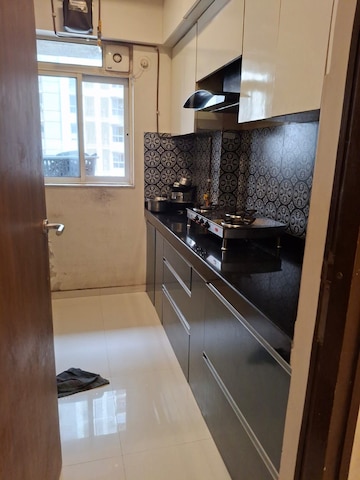 Kitchen in 1 BHK Apartment at Lodha Amara, Kolshet Road – for Sale