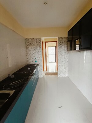 Kitchen in 1 BHK Apartment at Alpha Saffron Hill, Badlapur East – for Sale