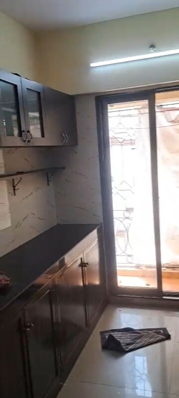 Kitchen in 2 BHK Apartment at Chanchal Kalyan Complex, Yari Road – for Rent