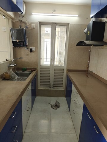 Kitchen in 2 BHK Apartment at Dosti West County, Balkum Pada – for Rent