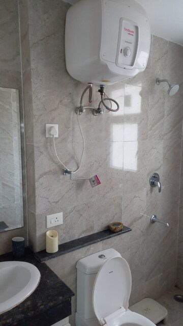 Bathroom in 3 BHK Apartment at Adani Oyster Grande Phase 2, Sector 102 – for Rent