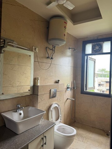 Bathroom in 3 BHK Builder Floor at Nehru Enclave – for Rent