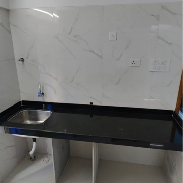 Kitchen in 2 BHK Apartment at Goyal Sea Rock, Ic Colony – for Sale