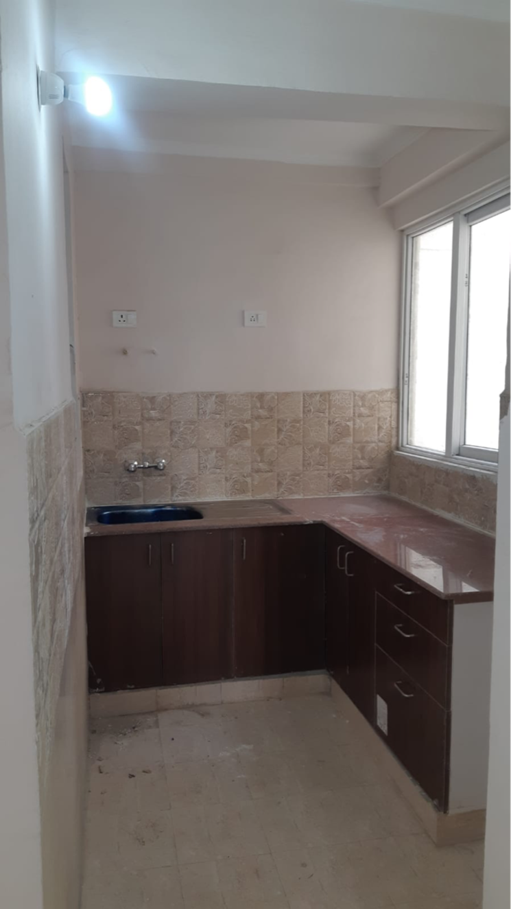 Kitchen, amrapali-golf-homes 2.5 Bedroom 945 Sq.Ft. Apartment In Haibatpur Greater Noida 9063756