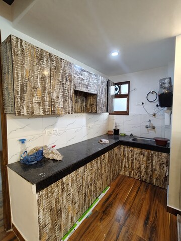 Kitchen in 2 BHK Builder Floor at Freedom Fighters Enclave – for Rent