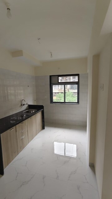 Kitchen in 2 BHK Apartment at Sai Raj Flora, Ambivali – for Sale