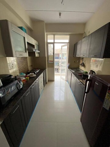 Kitchen in 2 BHK Apartment at Gaur City 2 - 14th Avenue, Sector 16c Greater Noida – for Rent