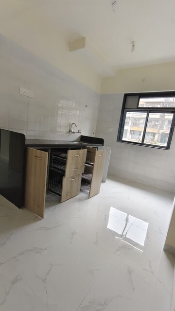 Kitchen in 2 BHK Apartment at Tisai Apartment, Kalyan East – for Sale