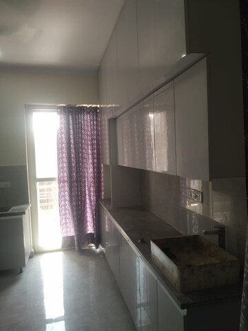 Kitchen in 3 BHK Apartment at Ansal API Esencia, Sector 67 – for Rent