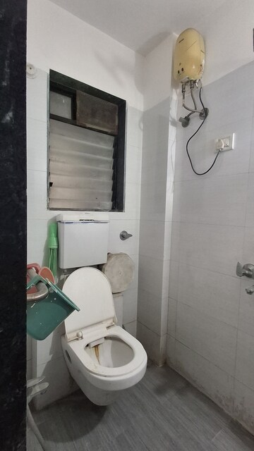 Bathroom in 1 BHK Apartment at RNA NG Suncity Phase II, Kandivali East – for Sale
