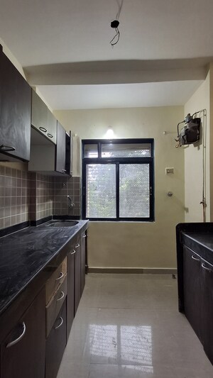 Kitchen in 1 BHK Apartment at RNA NG Suncity Phase II, Kandivali East – for Sale
