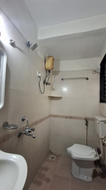 Bathroom in 2 BHK Apartment at RNA NG Suncity Phase II, Kandivali East – for Rent