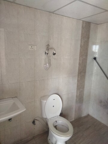 Bathroom in 2 BHK Apartment at Charms Castle, Raj Nagar Extension – for Rent