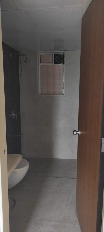 Bathroom in 2 BHK Apartment at Dosti West County, Balkum Pada – for Rent