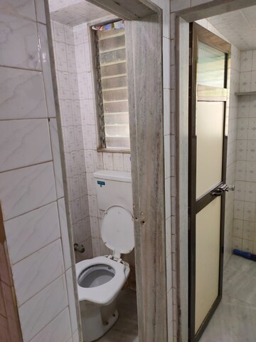 Master Bedroom in 1 BHK Apartment at Ganesh Chhaya CHS Borivali, Yogi Nagar – for Rent