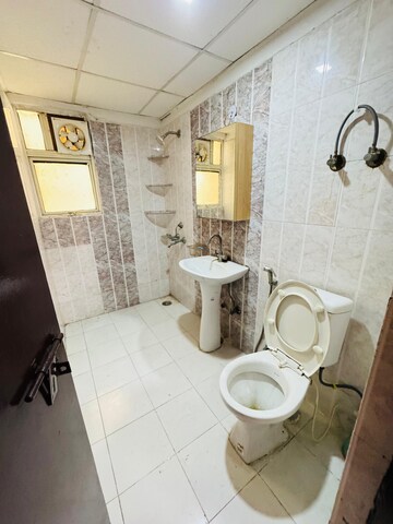 Bathroom in 3.5 BHK Apartment at Aims Golf City, Sector 75 – for Sale