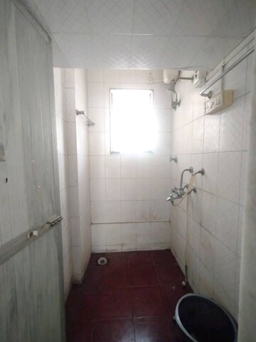 Bathroom in 1 BHK Apartment at Asha Nagar CHS, Mulund West – for Rent