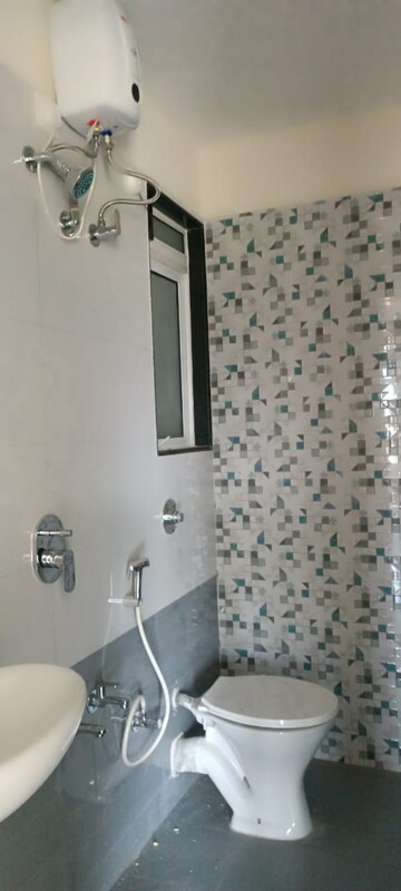 Bathroom in 2 BHK Apartment at Mahavir Kalpavruksha, Ghodbunder Road – for Rent
