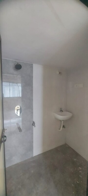 Bathroom in 2 BHK Apartment at Ramkunj CHS , Ganeshwadi – for Sale