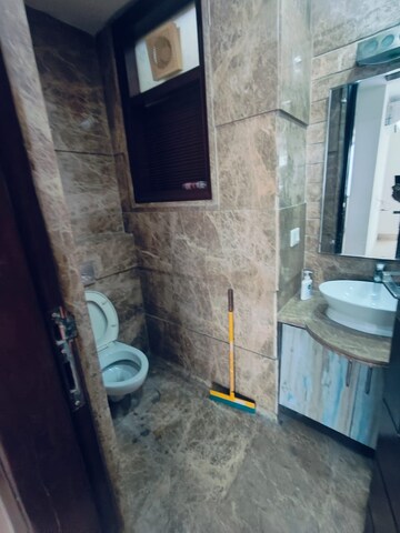 Bathroom in 4 BHK Apartment at Green Park Extension – for Rent