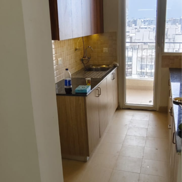 Kitchen in 3 BHK Apartment at Amrapali Crystal Homes, Sector 76 – for Sale