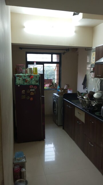 Kitchen in 2 BHK Apartment at Raunak Unnathi Woods Phase 4 And 5, Ghodbunder Road – for Rent