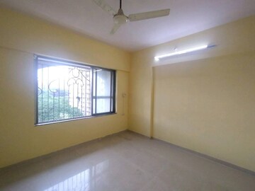 Master Bedroom in 2 BHK Apartment at Laxmi Royal Classic, Mulund West – for Rent
