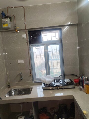 Kitchen in 1 BHK Apartment at Cosmos Classique, Ghodbunder Road – for Sale