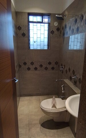 Bathroom in 1 BHK Apartment at Paradise Sai Suncity, Ghot – for Sale