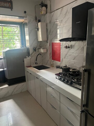 Kitchen in 2 BHK Apartment at Usha Gardens, Malad West – for Rent
