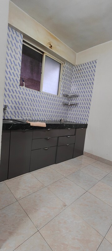 Kitchen in 2 BHK Apartment at J P Heights Apartment, Yashwant Nagar – for Rent