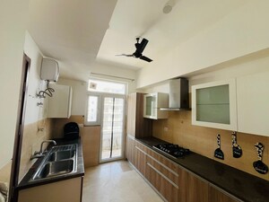 Kitchen in 3.5 BHK Apartment at Puri Emerald Bay, Sector 104 – for Sale