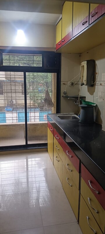 Kitchen in 1 BHK Apartment at Shubh-Man Mandir Apartment, Andheri West – for Sale