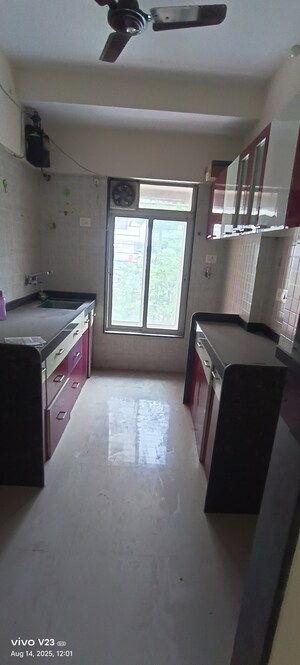 Kitchen in 2 BHK Apartment at Pushkraj Apartments, Goregaon East – for Sale