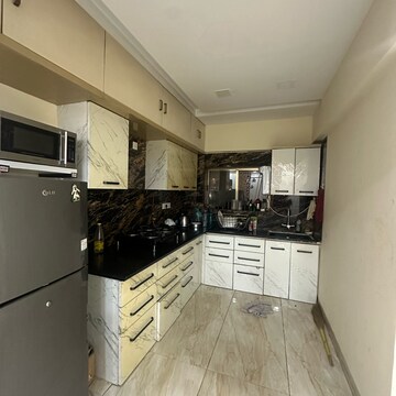 Kitchen in 2 BHK Apartment at Om Heights Malad East, Matanpur Nagar – for Rent