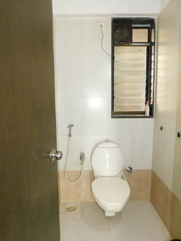 Bathroom in 2 BHK Apartment at Neptune Living Point, Bhandup West – for Rent