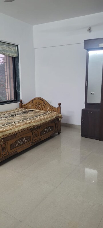 Bedroom in 2 BHK Apartment at Altiuus Drome Apartment, Wadgaon Sheri – for Rent