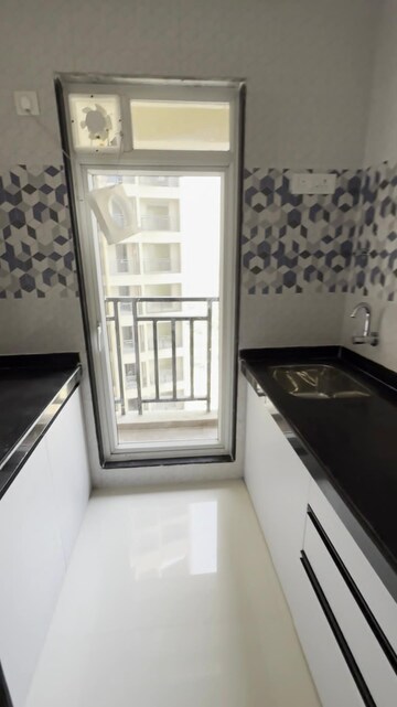 Kitchen in 1 BHK Apartment at Raunak Bliss, Ghodbunder Road – for Rent