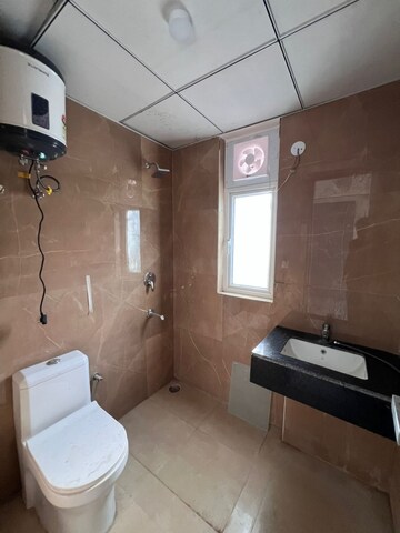 Bathroom in 2.5 BHK Builder Floor at Smart World Gems, Sector 89 – for Rent