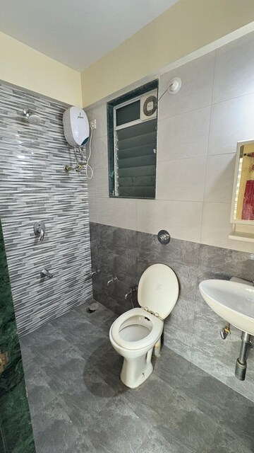 Bathroom in 2 BHK Apartment at Raunak Unnathi Woods Phase 4 And 5, Ghodbunder Road – for Rent