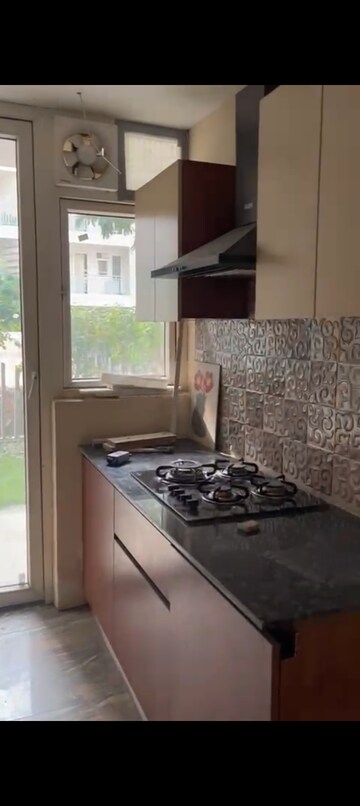 Kitchen in 3 BHK Apartment at Rise Sports Villas, Sector 1 Greater Noida – for Rent