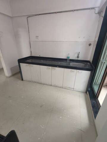 Kitchen in 2.5 BHK Apartment at Shree Satya Shankar Residency, Manpada – for Rent