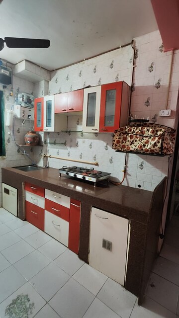 Kitchen in 1 BHK Apartment at Yash Anand CHS, Naupada – for Rent